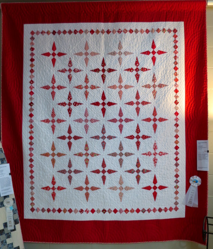 Thirty-Something Shades of Red by featured quilter