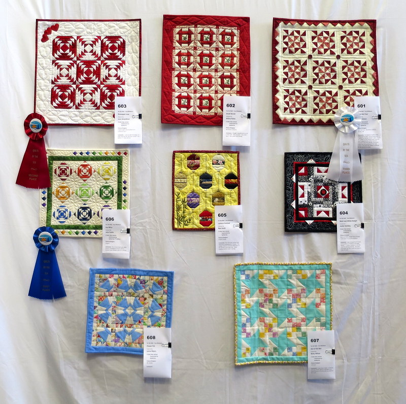 wall of mini quilts OCQG Aug 2016