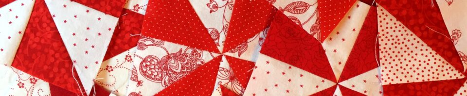 Red and white quilt patchwork design.