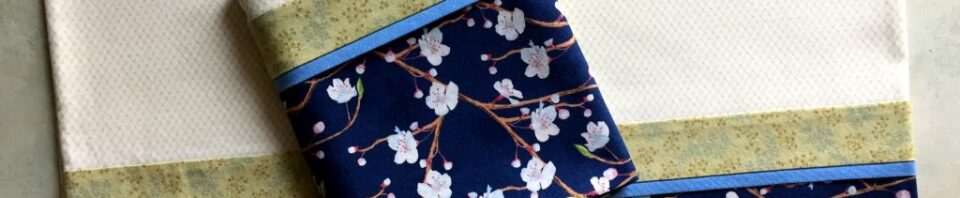 Decorative fabric with floral patterns and colors.