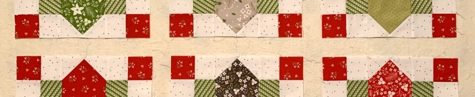 Six colorful quilt blocks arranged in a grid.