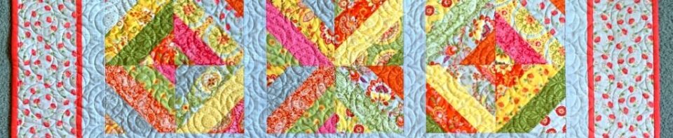 Colorful patchwork quilt with floral patterns.