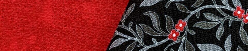 Red and black fabric with floral pattern.