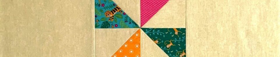 Colorful quilt patchwork design with triangles.