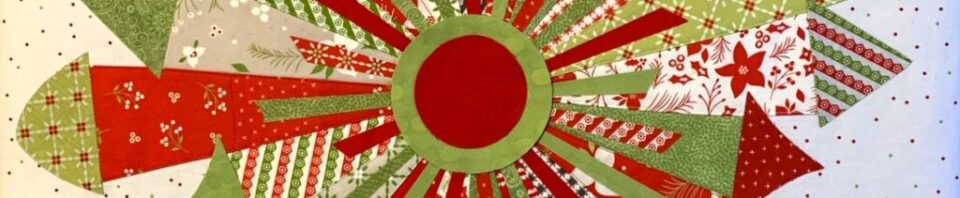 Colorful patchwork quilt design in red and green.