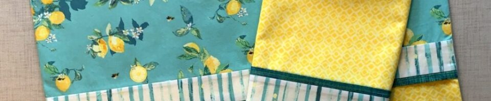 Lemon-patterned tablecloth and napkin set.