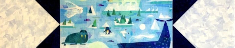 Colorful quilt featuring Arctic animals and scenery.