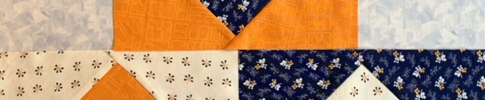 Colorful quilt patchwork design with floral patterns.